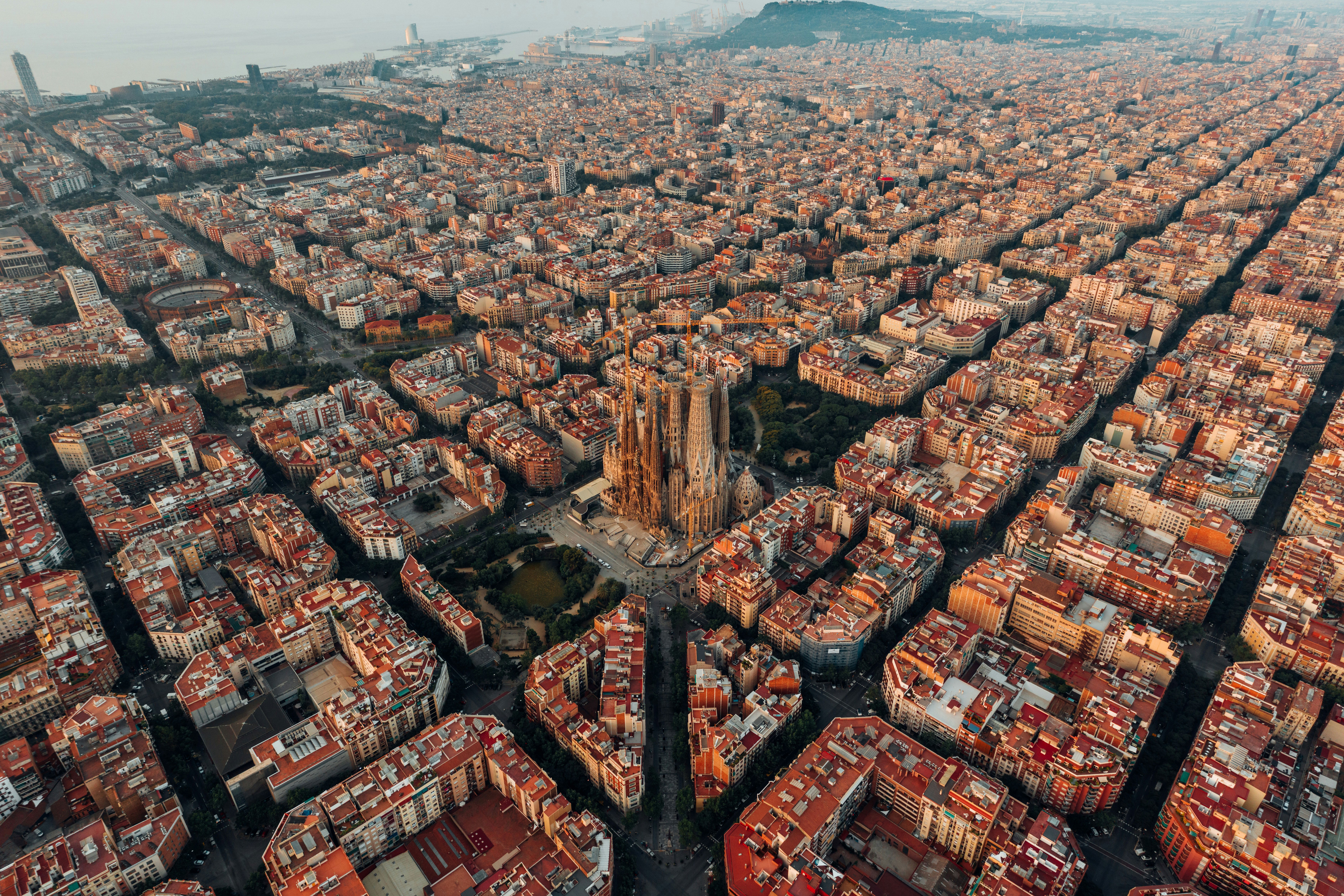 Aerial view of Barcelona, Spain, showcasing the city’s iconic architecture and Mediterranean lifestyle — perfect for buying a second home or luxury property investment.